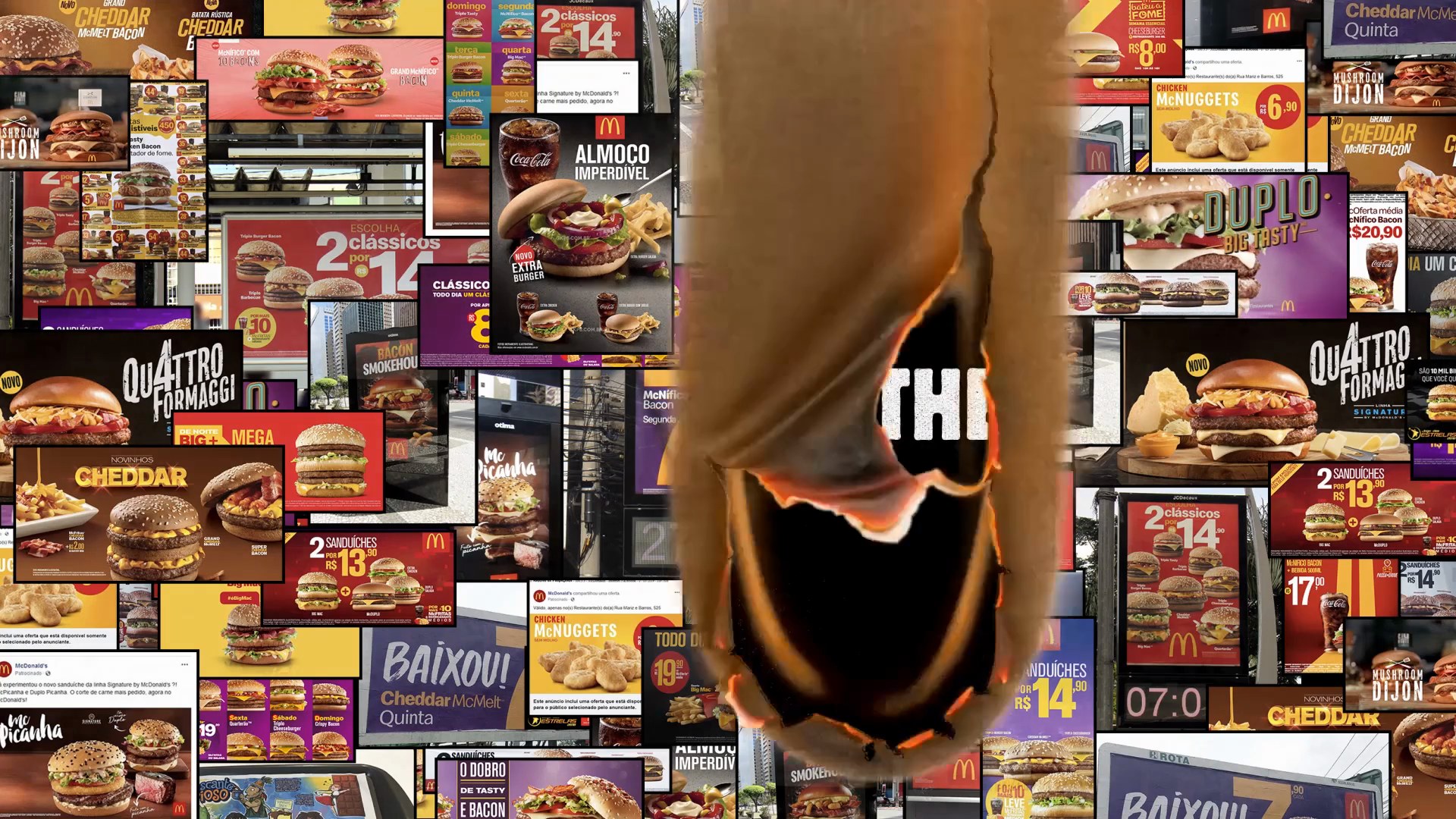 A wall papered with rival fast food ads, one of them burning through