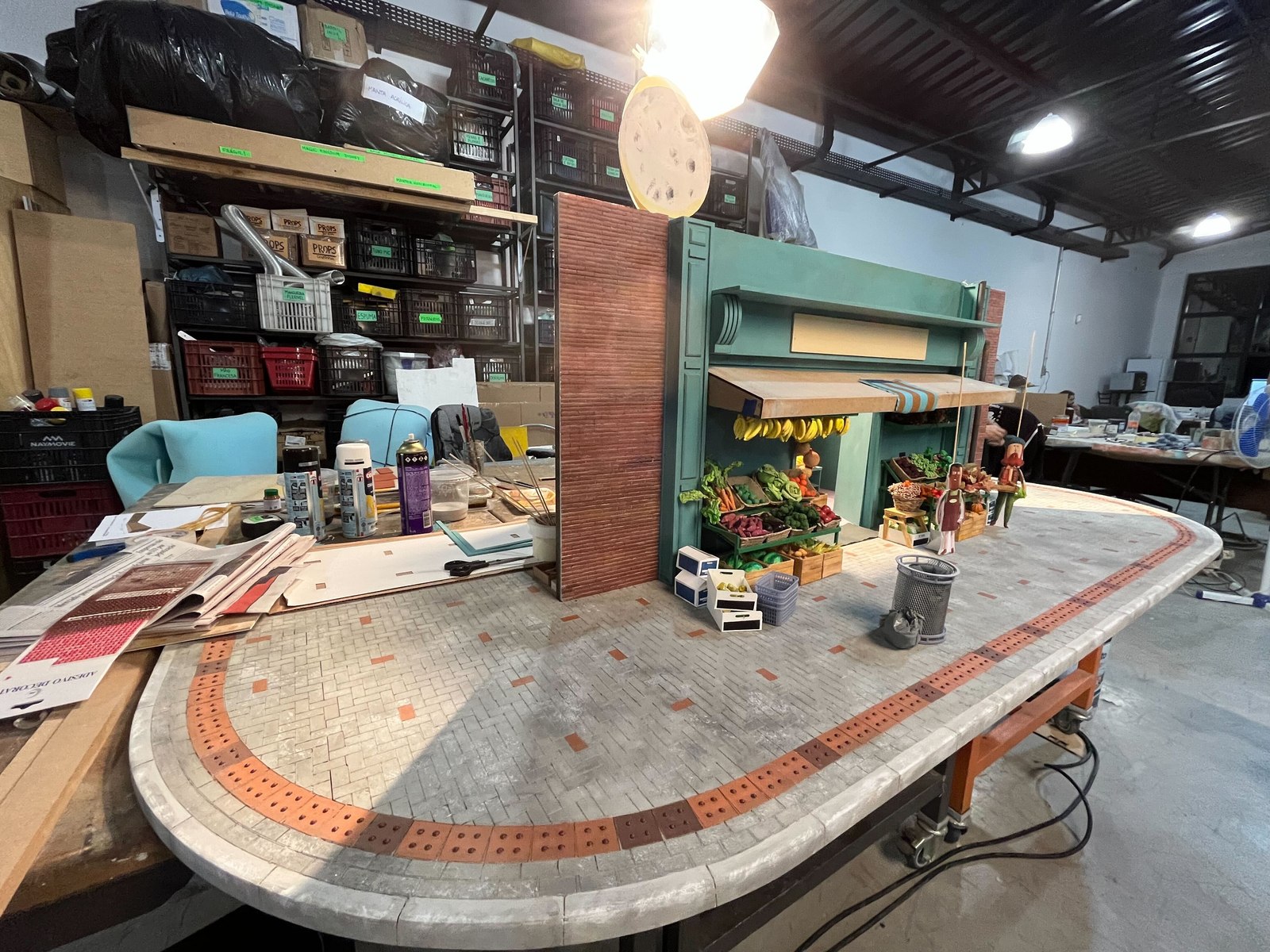 The miniature street set under construction in the studio