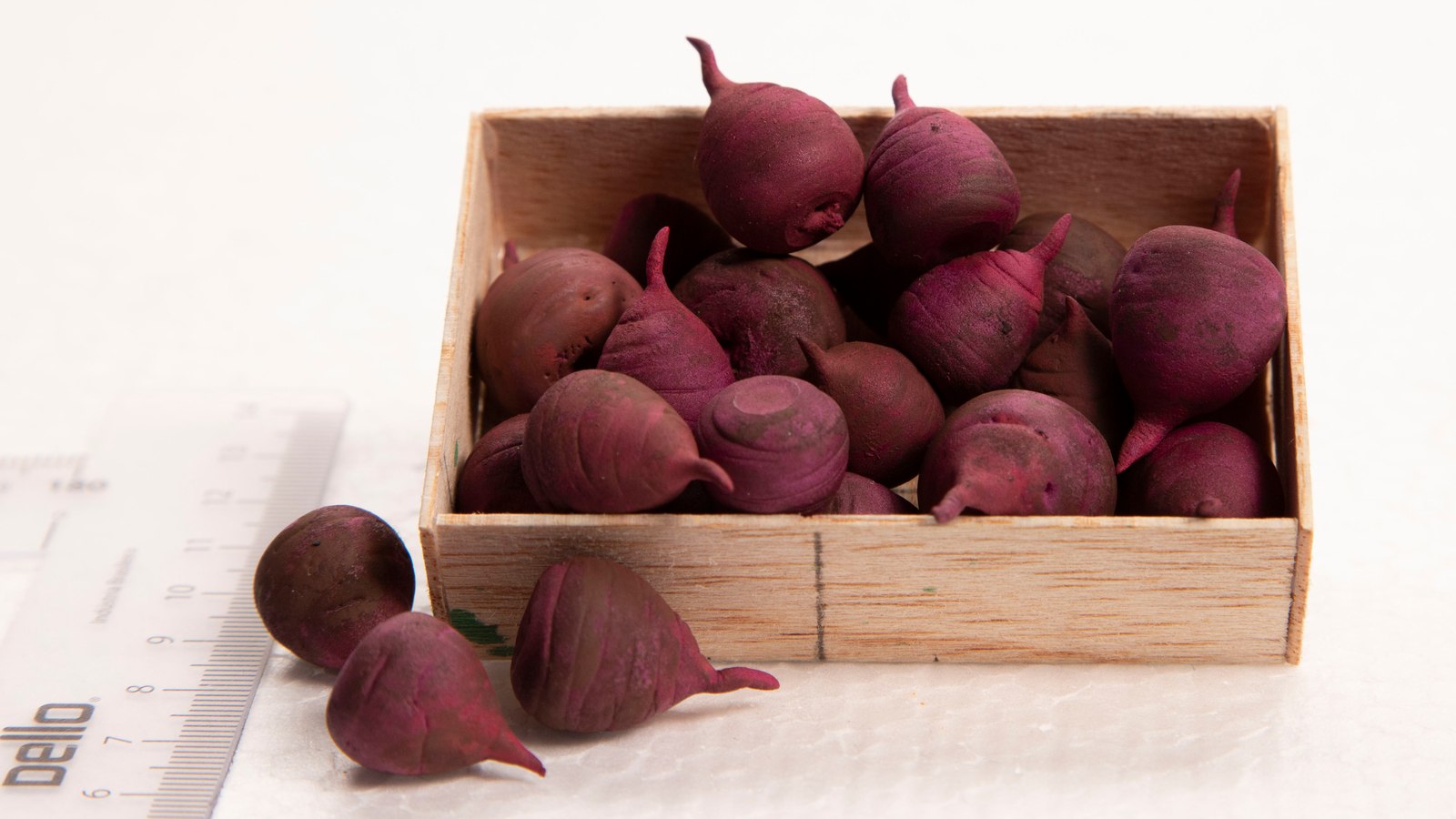 Handmade miniature beetroot in a crate