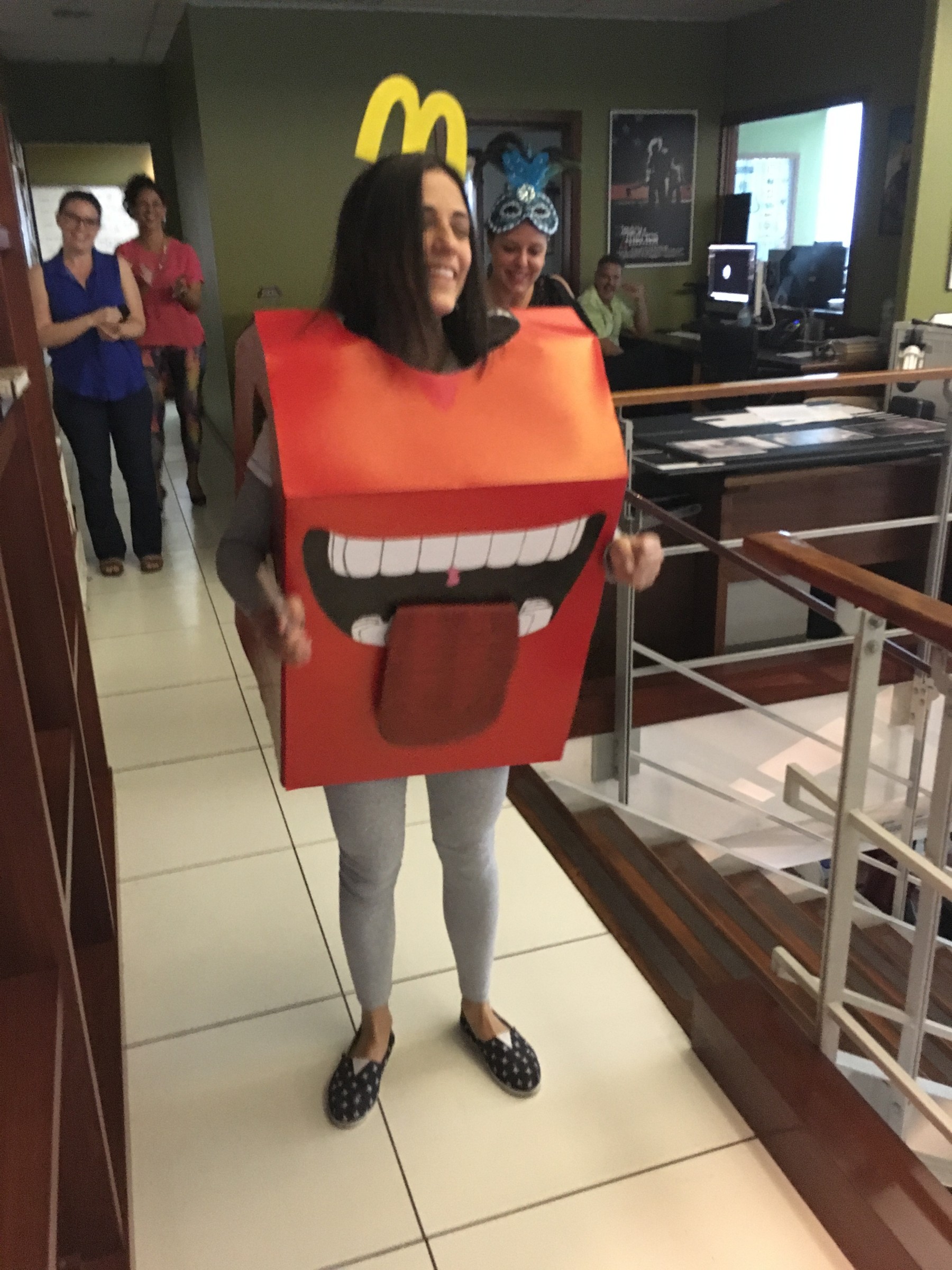 A LOBO team member wearing a handmade Happy Meal box costume in the studio