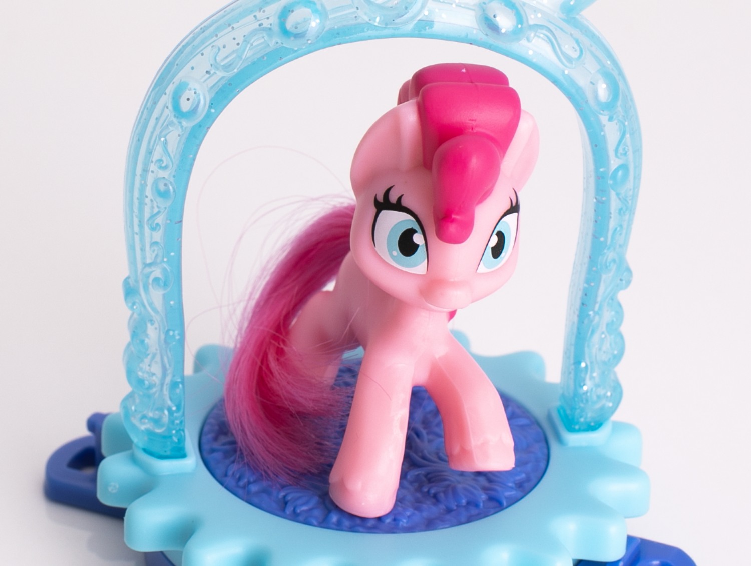 A My Little Pony figure inside a translucent glittered carousel