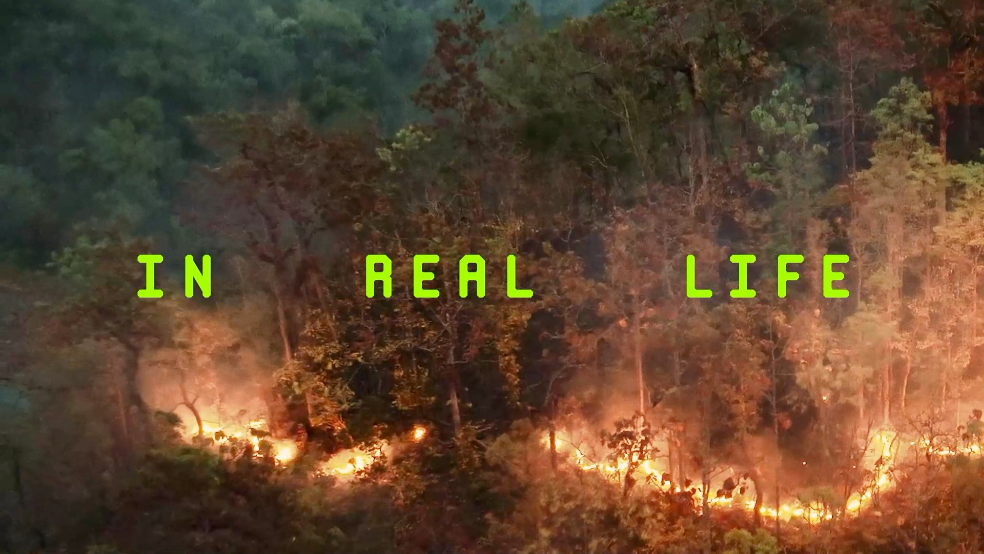 An aerial view of forest fire spreading through the Amazon