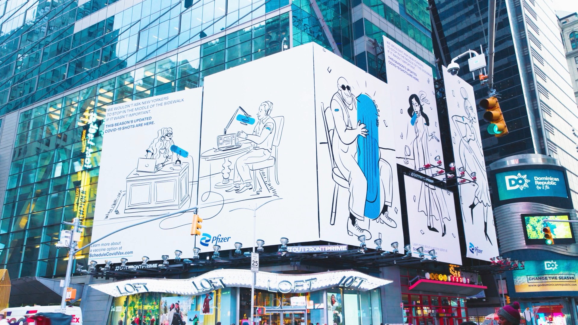 The Doodles campaign running across full building screens in Times Square