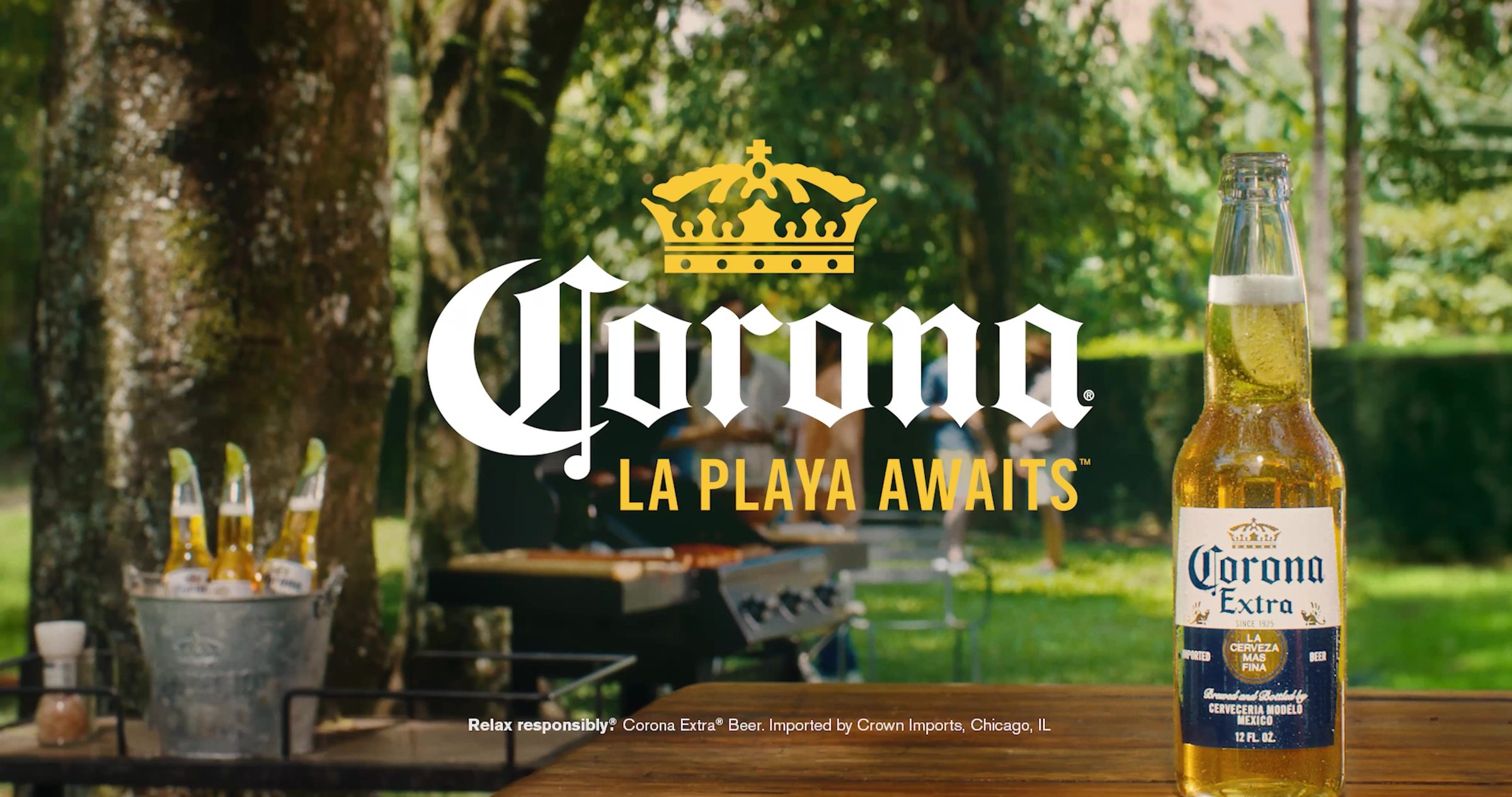 The La Playa Awaits end frame, Corona bottle and logo against a bright outdoor setting
