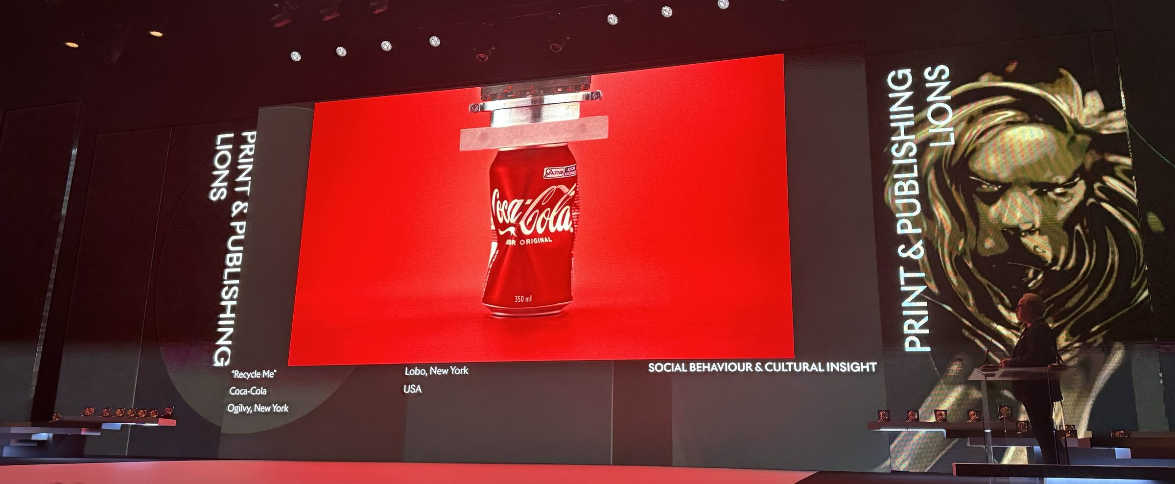 The Recycle Me work on screen at Cannes Lions beside the gold lion, Print and Publishing Lions